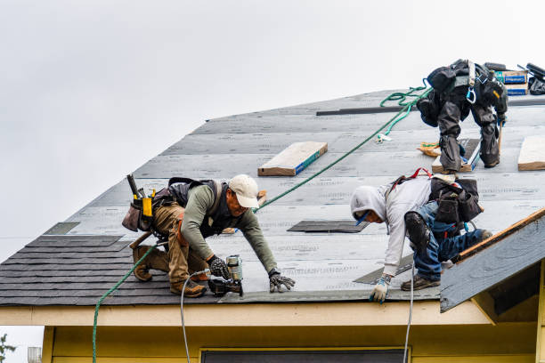 Professional Storm Damage Roof Repair technician working in North Bridgton, ME